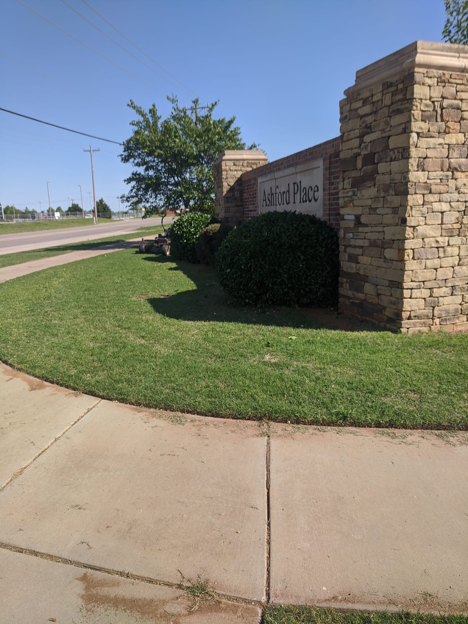An entrance to a neighborhood is even more welcoming with a beautifully landscaped entrance.
