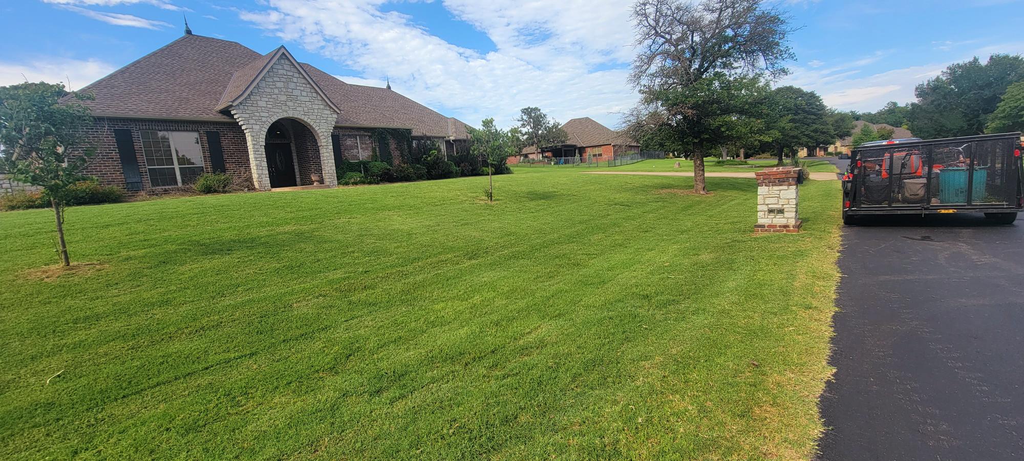 A beautiful home is complemented by a beautiful landscape.